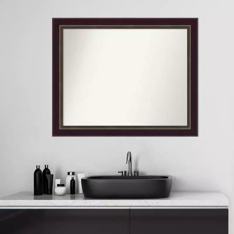 Miroir mural en bronze et bois