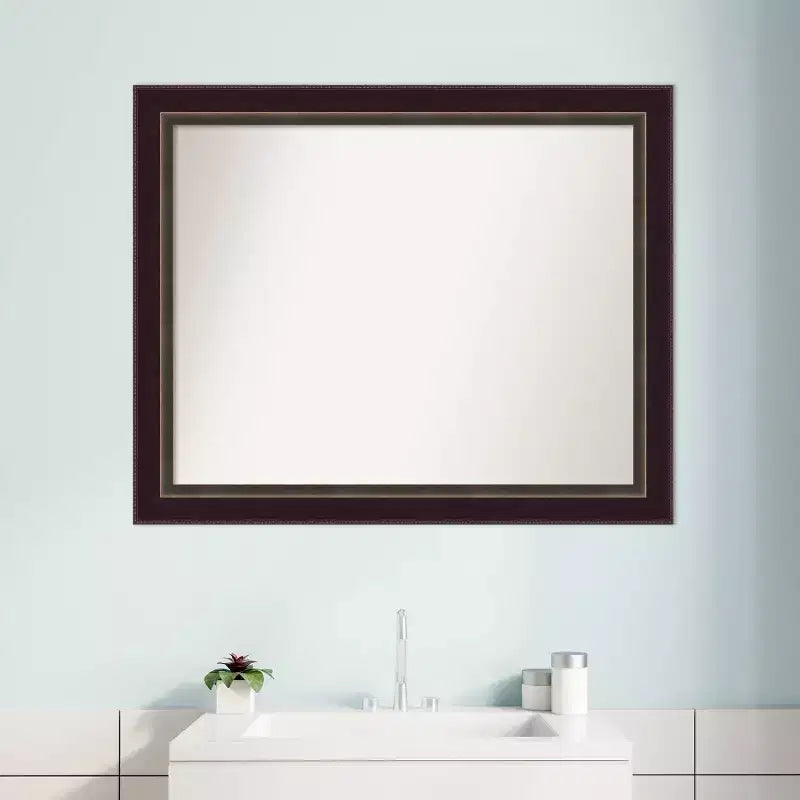 Miroir mural en bronze et bois